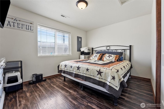 804 S Adams Ave, Warden, WA 98857 - bedroom featuring visible vents, baseboards, wood finished floors, and electric panel