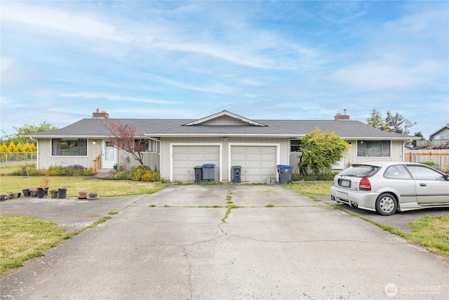9941 Old Olympic Hwy, Sequim, WA 98382 - single story home with a chimney, a garage, concrete driveway, and board and batten siding