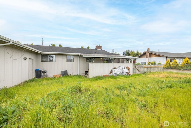 9941 Old Olympic Hwy, Sequim, WA 98382 - back of house featuring a chimney