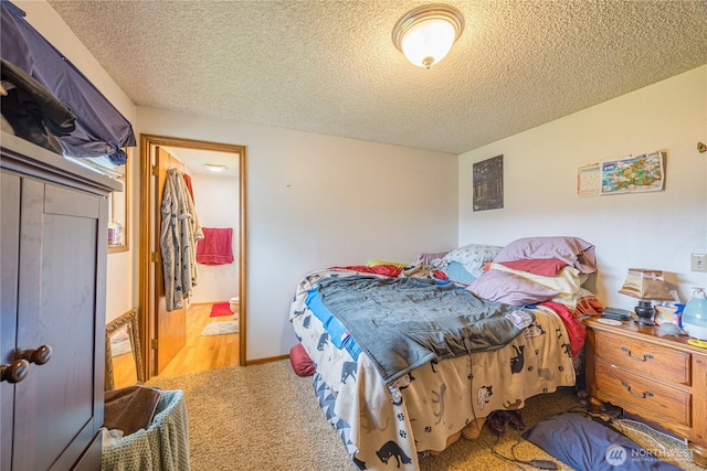 9941 Old Olympic Hwy, Sequim, WA 98382 - bedroom featuring carpet floors, a textured ceiling, and ensuite bathroom