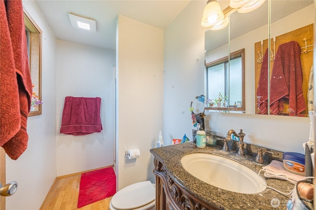 9941 Old Olympic Hwy, Sequim, WA 98382 - bathroom with toilet, wood finished floors, and vanity