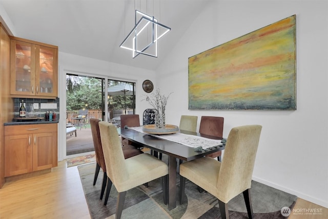 2212 186th Ave NE, Redmond, WA 98052 - dining space featuring high vaulted ceiling and light wood-style floors