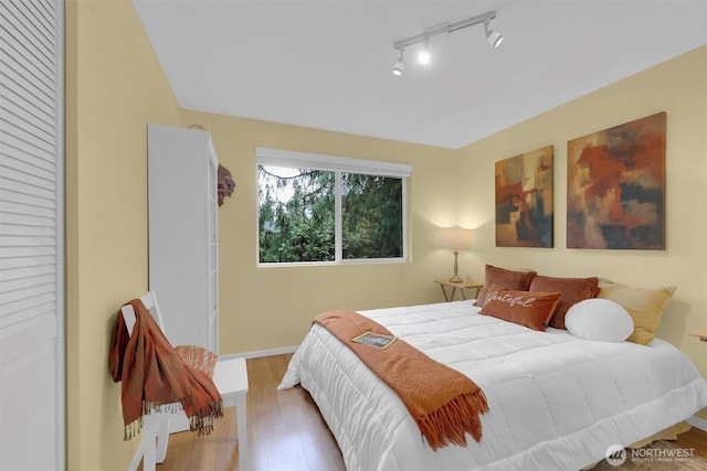 2212 186th Ave NE, Redmond, WA 98052 - bedroom featuring baseboards and wood finished floors