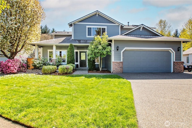 2825 Haig Dr SE, Olympia, WA 98501 - craftsman-style house with a porch, a front lawn, brick siding, an attached garage, and concrete driveway