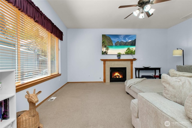 2825 Haig Dr SE, Olympia, WA 98501 - living room with ceiling fan, carpet, visible vents, a tile fireplace, and baseboards