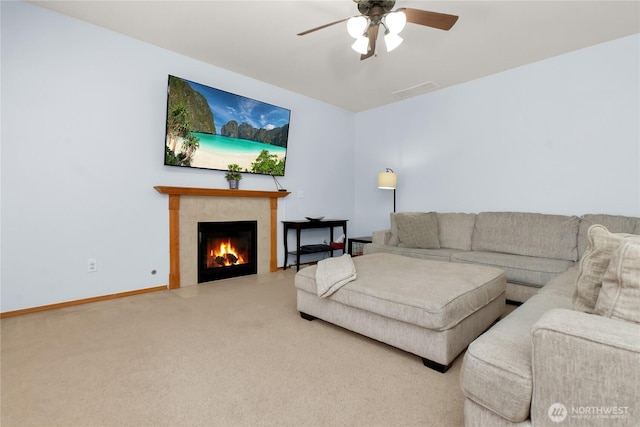 2825 Haig Dr SE, Olympia, WA 98501 - carpeted living room with baseboards, ceiling fan, a tiled fireplace, and visible vents