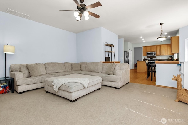 2825 Haig Dr SE, Olympia, WA 98501 - living area with visible vents, ceiling fan, and light carpet