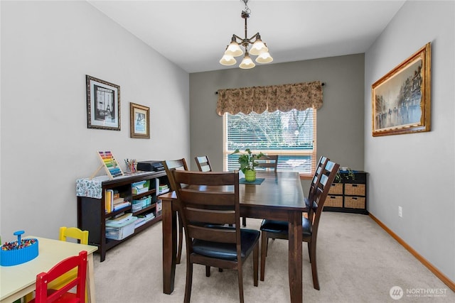 2825 Haig Dr SE, Olympia, WA 98501 - dining room featuring baseboards, an inviting chandelier, and light carpet