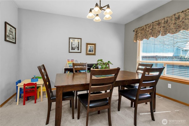 2825 Haig Dr SE, Olympia, WA 98501 - dining area featuring light colored carpet, an inviting chandelier, and baseboards