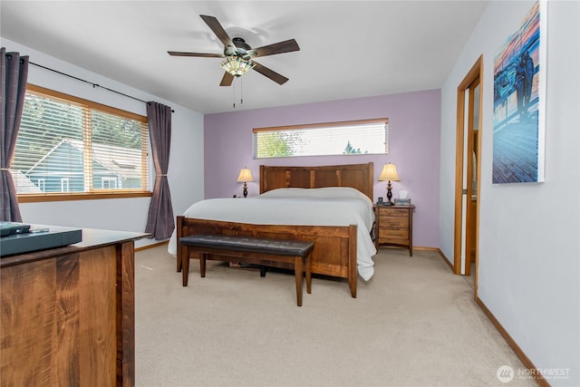 2825 Haig Dr SE, Olympia, WA 98501 - bedroom featuring a ceiling fan, light carpet, baseboards, and multiple windows