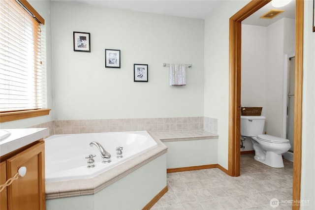 2825 Haig Dr SE, Olympia, WA 98501 - full bathroom featuring vanity, tile patterned flooring, toilet, visible vents, and a bath