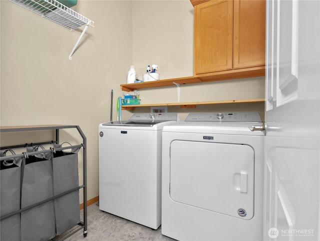 2825 Haig Dr SE, Olympia, WA 98501 - washroom featuring light tile patterned floors, washing machine and dryer, baseboards, and cabinet space