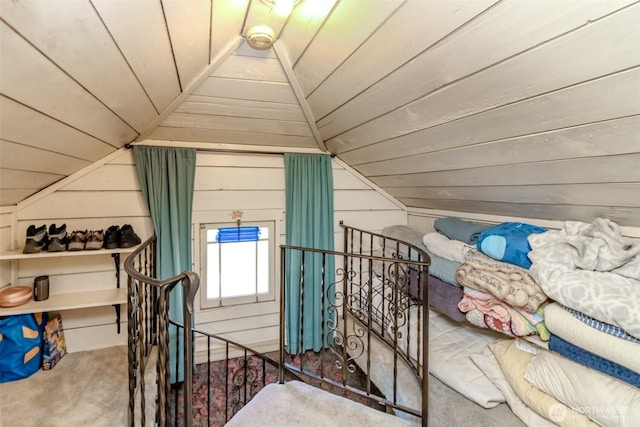 additional living space featuring wooden walls, wood ceiling, carpet, and vaulted ceiling