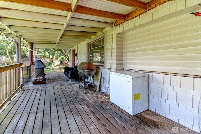 wooden terrace with grilling area