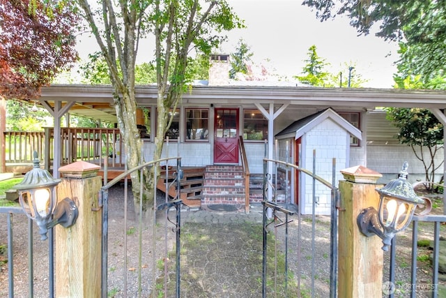 single story home with entry steps and a chimney
