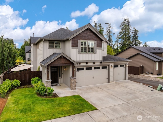 4407 N Ridgefield Woods Dr, Ridgefield, WA 98642 - craftsman-style house with board and batten siding, concrete driveway, a garage, and roof with shingles