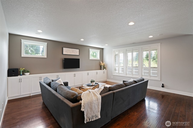 4407 N Ridgefield Woods Dr, Ridgefield, WA 98642 - living area featuring a textured ceiling, dark wood-style flooring, recessed lighting, and baseboards