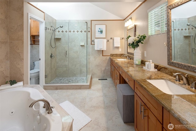 full bathroom featuring a stall shower, tile walls, tile patterned flooring, double vanity, and a jetted tub