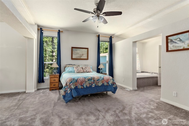 4592 Evenstar Ln, Freeland, WA 98249 - bedroom with carpet flooring, baseboards, ensuite bath, and a ceiling fan