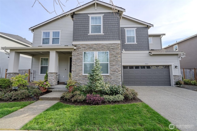 29027 NE 156th St, Duvall, WA 98019 - craftsman-style house with a porch, stone siding, a garage, and driveway