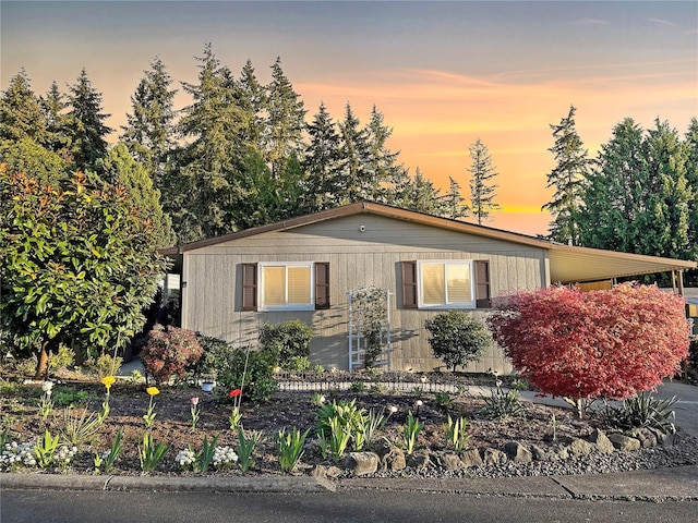 view of front of property with a carport