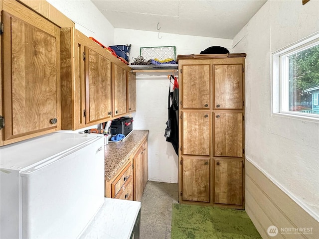 washroom featuring cabinet space