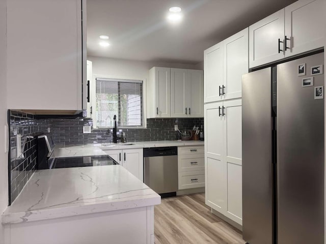 11703 NE 80th St Unit D3, Kirkland, WA 98033 - kitchen with a sink, stainless steel appliances, backsplash, white cabinets, and light stone countertops