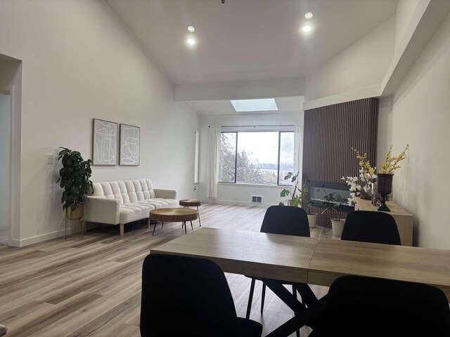 11703 NE 80th St Unit D3, Kirkland, WA 98033 - office area featuring a skylight, a towering ceiling, visible vents, recessed lighting, and light wood finished floors