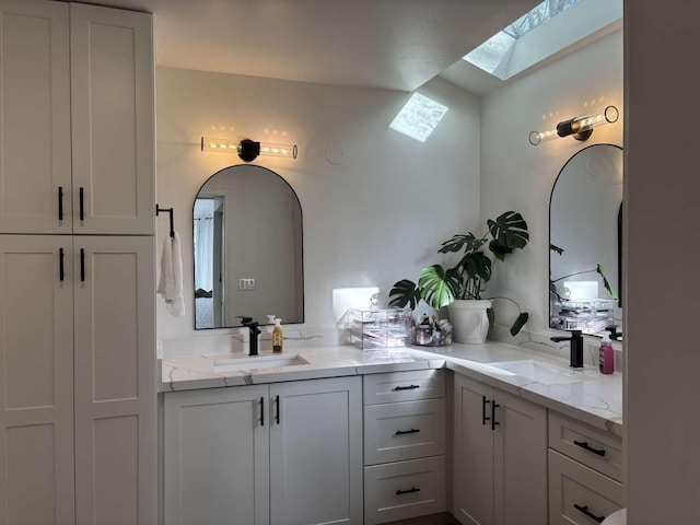 11703 NE 80th St Unit D3, Kirkland, WA 98033 - bathroom featuring vanity and a skylight
