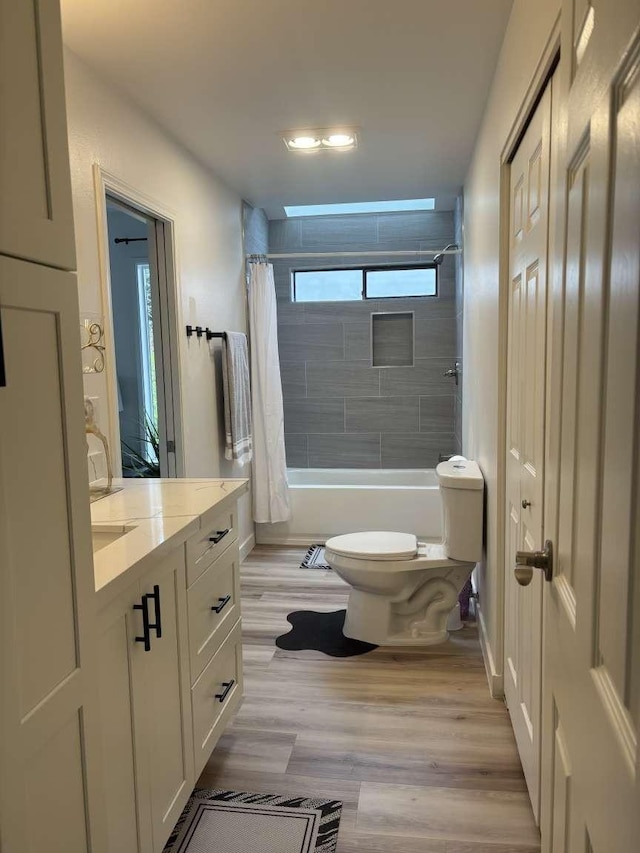 11703 NE 80th St Unit D3, Kirkland, WA 98033 - full bathroom featuring shower / bath combo with shower curtain, toilet, wood finished floors, and vanity