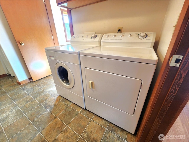 clothes washing area with laundry area and separate washer and dryer