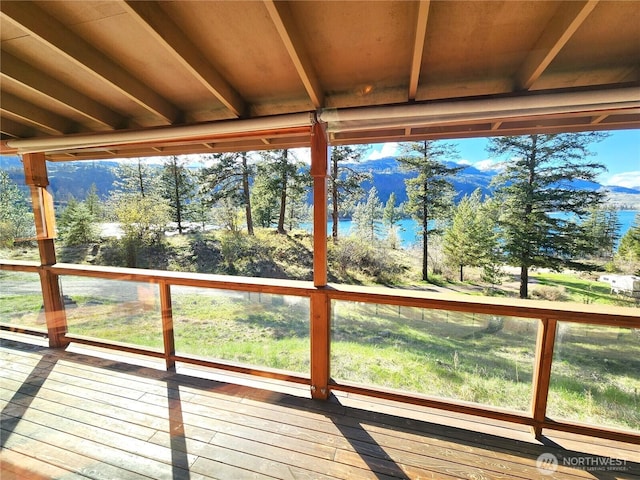 wooden terrace with a water view