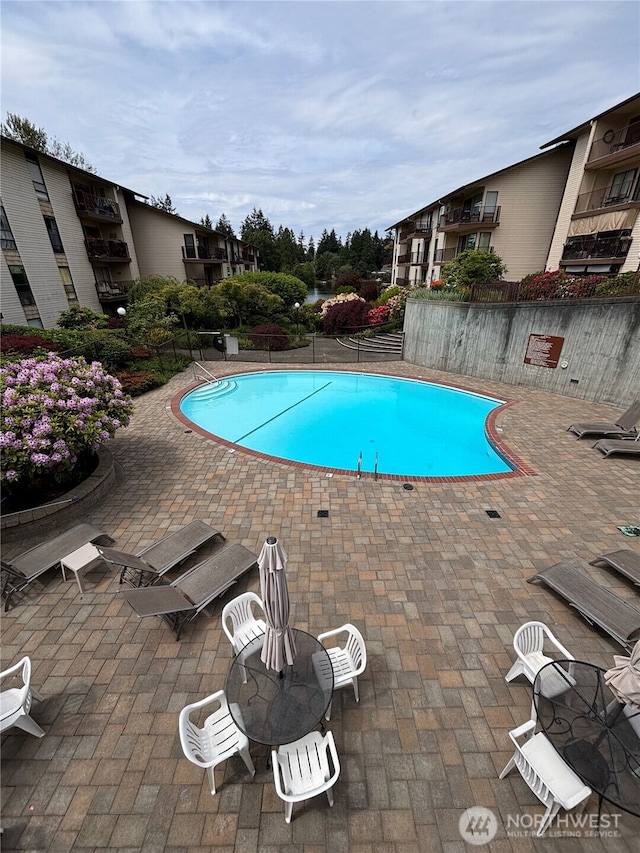 13201 Linden Ave N Unit 408A, Seattle, WA 98133 - community pool featuring a patio area