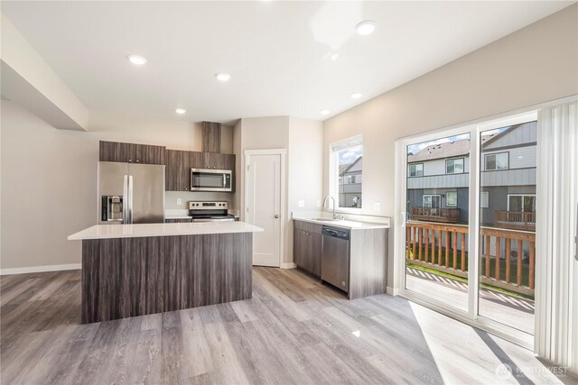 1848 Eastgate Loop, Ferndale, WA 98248 - kitchen featuring a sink, light countertops, a center island, stainless steel appliances, and modern cabinets