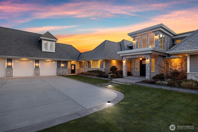 581 Marine Dr, Point Roberts, WA 98281 - view of front facade featuring stone siding, driveway, a front yard, and a garage