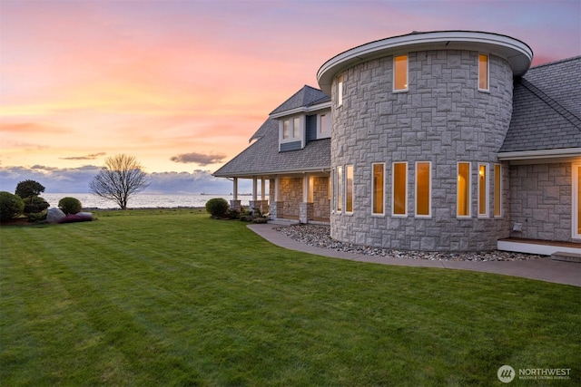 581 Marine Dr, Point Roberts, WA 98281 - rear view of house with a yard, a porch, and stone siding