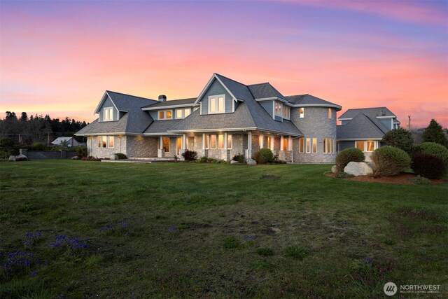 581 Marine Dr, Point Roberts, WA 98281 - view of front of house featuring stone siding and a front lawn