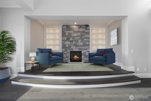 581 Marine Dr, Point Roberts, WA 98281 - living area with baseboards, wood finished floors, built in shelves, and a stone fireplace