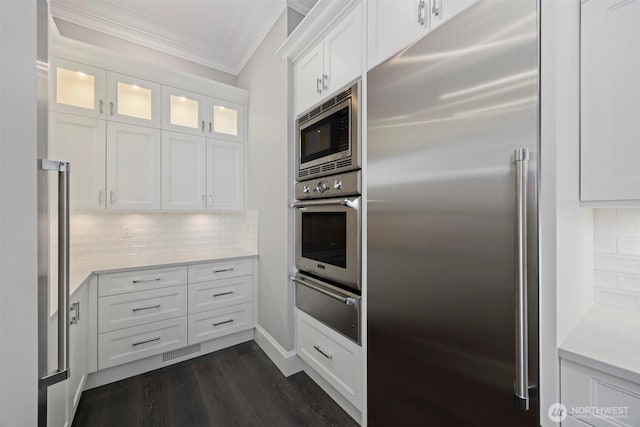581 Marine Dr, Point Roberts, WA 98281 - kitchen featuring crown molding, a warming drawer, stainless steel appliances, light countertops, and white cabinetry