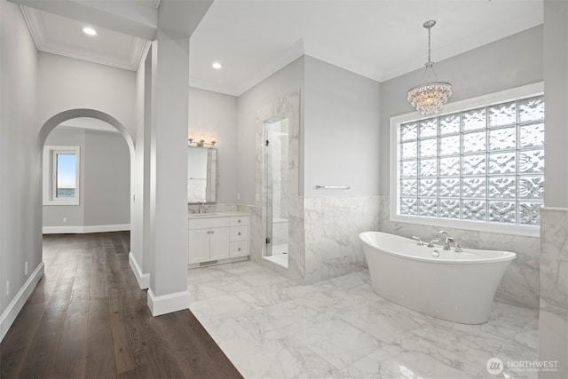 581 Marine Dr, Point Roberts, WA 98281 - bathroom with a freestanding tub, vanity, a stall shower, and ornamental molding
