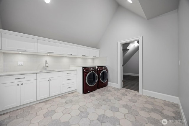 581 Marine Dr, Point Roberts, WA 98281 - laundry room featuring a sink, light floors, cabinet space, baseboards, and independent washer and dryer