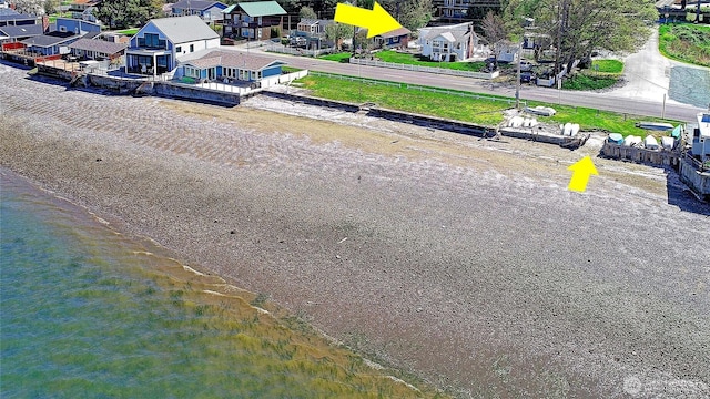 drone / aerial view with a residential view and a water view