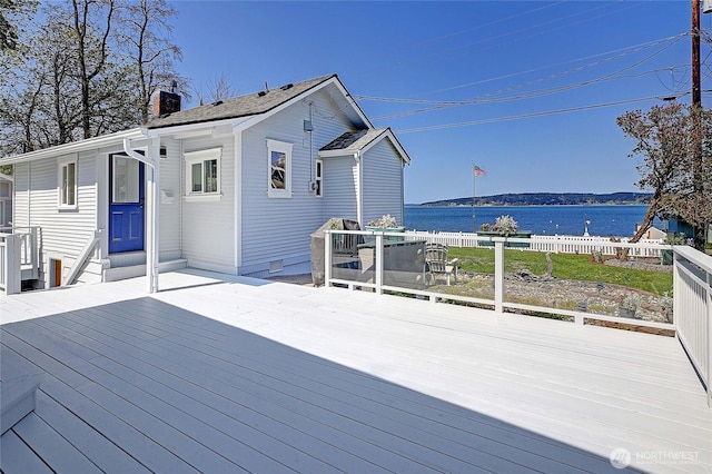 wooden terrace with a water view