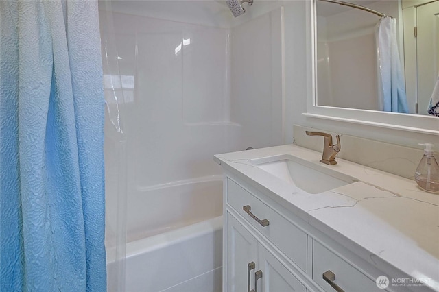 bathroom with vanity and shower / bath combo