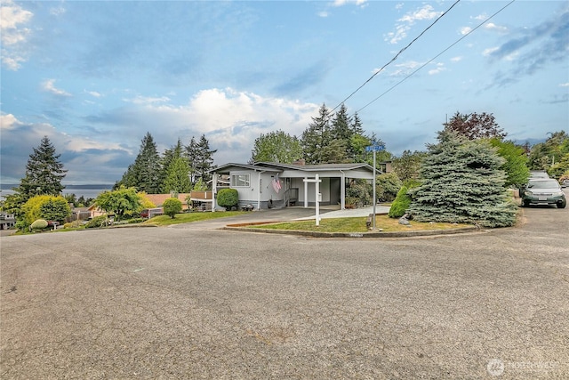 view of front of house featuring an attached carport