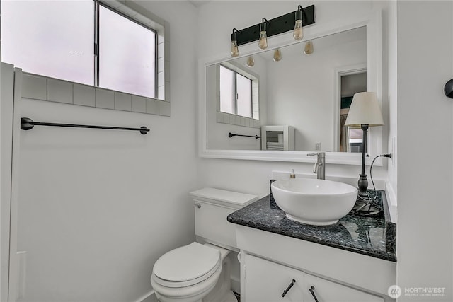 bathroom with vanity and toilet
