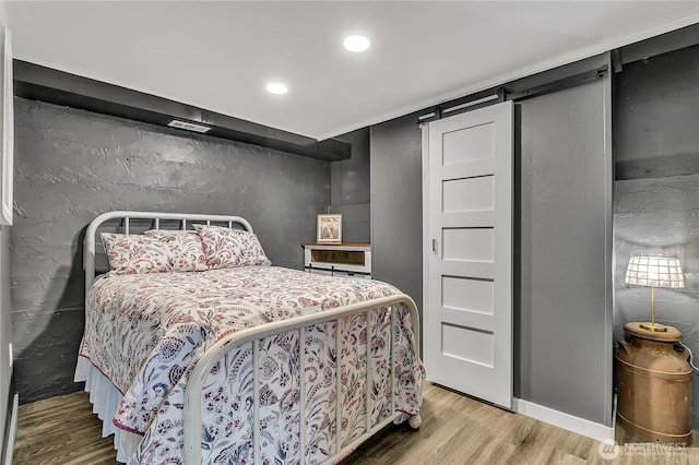 bedroom featuring recessed lighting, wood finished floors, and visible vents