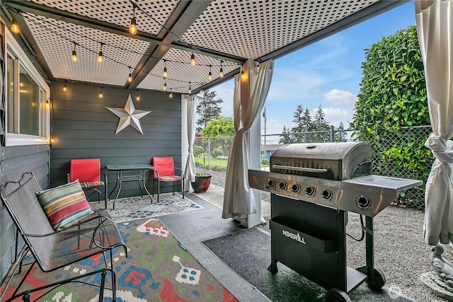 view of patio / terrace featuring fence and grilling area