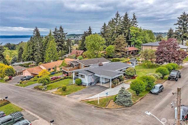 birds eye view of property with a water view