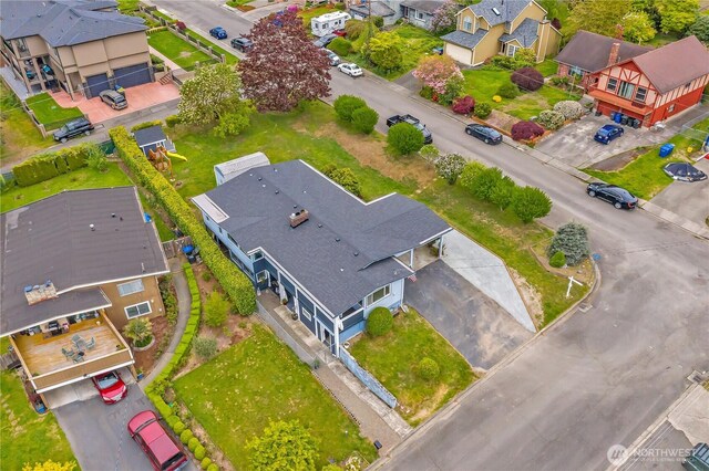 birds eye view of property with a residential view
